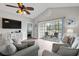 Living area with vaulted ceiling, ceiling fan, a TV and sliding glass doors leading to a porch at 4870 Dahlia Ct. # 304, Myrtle Beach, SC 29577