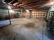 Spacious unfinished basement featuring concrete floor, overhead beams and an unfinished garage door at 51 Cleburn St., Georgetown, SC 29440