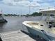 Docked boat with seating featuring water and other boats in the background on a sunny day at 51 Cleburn St., Georgetown, SC 29440