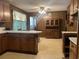 Spacious kitchen with wood cabinets, a dining area, and vintage-style flooring at 51 Cleburn St., Georgetown, SC 29440