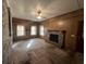 Cozy living room featuring a brick fireplace, wood paneled walls, and large windows at 51 Cleburn St., Georgetown, SC 29440