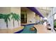 Indoor lazy river pool featuring tropical murals, and a relaxing recreational water experience at 5200 N Ocean Blvd. # 151, Myrtle Beach, SC 29577