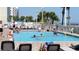 Inviting outdoor pool area with lounge chairs, perfect for relaxation and enjoying the sun at 5200 N Ocean Blvd. # 152, Myrtle Beach, SC 29577