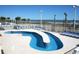 Outdoor pool area with lounge chairs and partial ocean view at 5200 N Ocean Blvd. # 152, Myrtle Beach, SC 29577