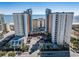 Beautiful beachfront resort with multiple towers, palm trees, and a circular driveway at 5200 N Ocean Blvd. # 155, Myrtle Beach, SC 29577