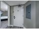 Hallway leading to a bedroom with wood flooring and a gray painted walls at 5200 N Ocean Blvd. # 155, Myrtle Beach, SC 29577