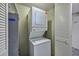 Compact laundry area with stacked washer and dryer, maximizing space at 5200 N Ocean Blvd. # 155, Myrtle Beach, SC 29577