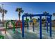 A vibrant splash pad offers a fun water play area, perfect for cooling off on sunny days with palm trees and the beach nearby at 5200 N Ocean Blvd. # 155, Myrtle Beach, SC 29577