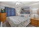 Relaxing bedroom with nautical decor, ceiling fan and an abundance of natural light at 5511 North Ocean Blvd. # 1105, Myrtle Beach, SC 29577