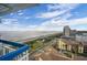 Breathtaking ocean view from the balcony with sandy beach and blue skies at 5511 North Ocean Blvd. # 1105, Myrtle Beach, SC 29577