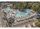 Stunning aerial view of water park featuring lazy river, pools, slides, lush landscaping, and ample lounging at 6001 -1005 S Kings Hwy., Myrtle Beach, SC 29575