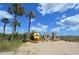 Scenic view of the beach with a tall sign in front of a beautiful blue sky with few clouds at 6001 -1005 S Kings Hwy., Myrtle Beach, SC 29575