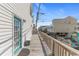 Deck view with a clear, sunlit sky background on an elevated beach house at 6001 -1005 S Kings Hwy., Myrtle Beach, SC 29575