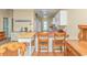 View of the kitchen featuring a breakfast bar with wooden chairs and white cabinets at 6001 -1005 S Kings Hwy., Myrtle Beach, SC 29575