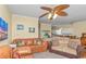 Cozy living room with sofas, a ceiling fan, and a view of the kitchen and dining area at 6001 -1005 S Kings Hwy., Myrtle Beach, SC 29575