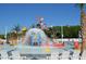 Vibrant splash zone features colorful play structures with a large tipping bucket, surrounded by lounge seating at 6001 -1005 S Kings Hwy., Myrtle Beach, SC 29575