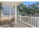 Relax on the balcony featuring comfortable outdoor furniture with views of mature trees at 6001-L11 South Kings Hwy., Myrtle Beach, SC 29575