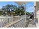 Spacious balcony with seating and a grill, perfect for outdoor entertaining and enjoying the neighborhood view at 6001-L11 South Kings Hwy., Myrtle Beach, SC 29575