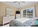 Bright bedroom with white dresser and seashore-themed decor at 6001-L11 South Kings Hwy., Myrtle Beach, SC 29575