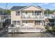 Two-story home featuring double balconies and neutral-colored siding at 6001-L11 South Kings Hwy., Myrtle Beach, SC 29575