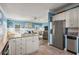 Open concept kitchen with a breakfast bar seamlessly connects to the dining and living spaces at 6001-L11 South Kings Hwy., Myrtle Beach, SC 29575