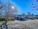 Townhome exterior with covered parking and lush landscaping against a clear blue sky at 601 Gloucester Terrace Circle # 3-A, Myrtle Beach, SC 29572