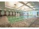 Large indoor pool with a lifeguard and chairs at 601 Gloucester Terrace Circle # 3-A, Myrtle Beach, SC 29572