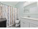 Bathroom features a white vanity and a toilet with a shower curtain at 601 N Hillside Dr. # 4632, North Myrtle Beach, SC 29582