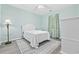 Bright and airy bedroom with a plush bed, stylish decor, and a large window at 601 N Hillside Dr. # 4632, North Myrtle Beach, SC 29582