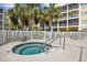 Enjoyable community hot tub surrounded by palm trees with nearby lounging area and seating at 601 N Hillside Dr. # 4632, North Myrtle Beach, SC 29582