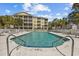 Relaxing community pool area with lounge chairs and a yellow condo complex in the background at 601 N Hillside Dr. # 4632, North Myrtle Beach, SC 29582