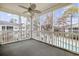 Relaxing screened porch with a ceiling fan overlooking community pool and landscaping at 601 N Hillside Dr. # 4632, North Myrtle Beach, SC 29582