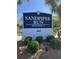 Sandpiper Run Building A sign at 645 with lush greenery at 645 Retreat Beach Circle, Pawleys Island, SC 29585