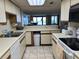 Bright kitchen with open view into the living room and sliding glass doors to the outside at 645 Retreat Beach Circle, Pawleys Island, SC 29585