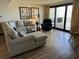 Comfortable living room with modern decor and access to the balcony at 645 Retreat Beach Circle, Pawleys Island, SC 29585