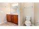 Bathroom vanity featuring wood cabinets, tile flooring, ample counter space, and modern fixtures at 654 Old Castle Loop, Myrtle Beach, SC 29579