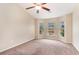 Bedroom with neutral carpet, natural light from three large windows, and spacious layout at 654 Old Castle Loop, Myrtle Beach, SC 29579