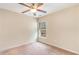 Bright bedroom with neutral carpet, ample natural light from a single window, and a ceiling fan at 654 Old Castle Loop, Myrtle Beach, SC 29579