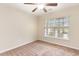 Bright bedroom with neutral carpet, ceiling fan, and natural light from a large window at 654 Old Castle Loop, Myrtle Beach, SC 29579