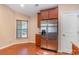 Kitchen featuring stainless steel refrigerator, granite countertops, and cherry cabinets at 654 Old Castle Loop, Myrtle Beach, SC 29579