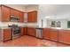 Kitchen featuring stainless appliances, granite countertops, and cherry cabinets at 654 Old Castle Loop, Myrtle Beach, SC 29579