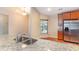 Kitchen featuring a large granite countertop with stainless steel sink and cabinets at 654 Old Castle Loop, Myrtle Beach, SC 29579