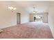 Spacious living room with vaulted ceiling, fan, and sliding glass doors leading to the outdoors at 654 Old Castle Loop, Myrtle Beach, SC 29579