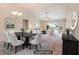 Staged open-concept living and dining area with vaulted ceiling and neutral decor at 654 Old Castle Loop, Myrtle Beach, SC 29579