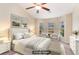 Bright main bedroom features a ceiling fan, sitting area, and plenty of natural light at 654 Old Castle Loop, Myrtle Beach, SC 29579