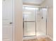 Bathroom walk-in shower with glass doors, storage shelves, and updated fixtures at 654 Old Castle Loop, Myrtle Beach, SC 29579