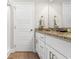 Bathroom boasts a double sink vanity with granite countertops and white cabinets at 685 Tidal Point Ln., Myrtle Beach, SC 29579