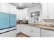 Bright kitchen featuring white cabinets, granite countertops, and stainless steel appliances at 685 Tidal Point Ln., Myrtle Beach, SC 29579