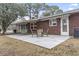 Back patio with a table and chairs, along with an awning and access to the home's exterior at 693 Mallard Lake Dr., Myrtle Beach, SC 29577