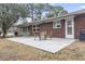 Back patio with a table and chairs, along with an awning and access to the home's exterior at 693 Mallard Lake Dr., Myrtle Beach, SC 29577